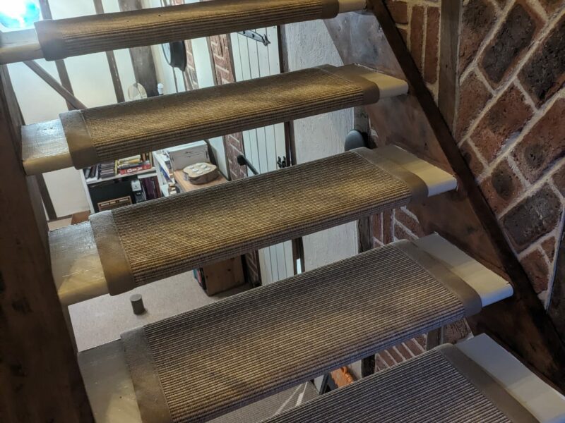 Unnatural Flooring - NE Stamford with Jaspa woven - Monarch (polypropylene binding) open stairs